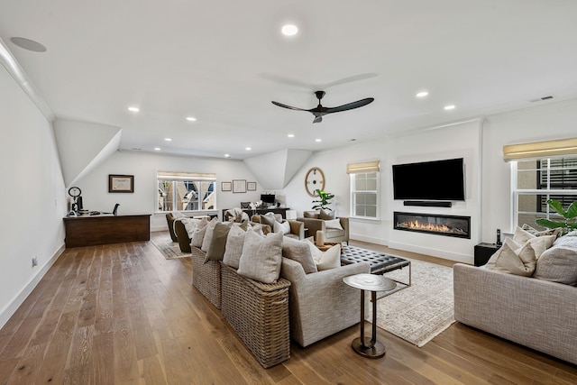 living room featuring ceiling fan and wood-type flooring