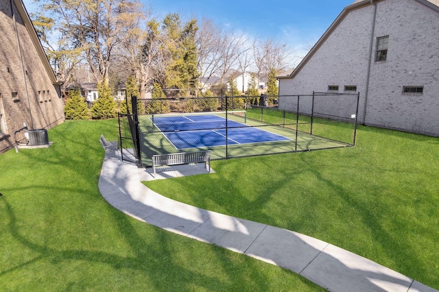 view of basketball court featuring a yard and tennis court