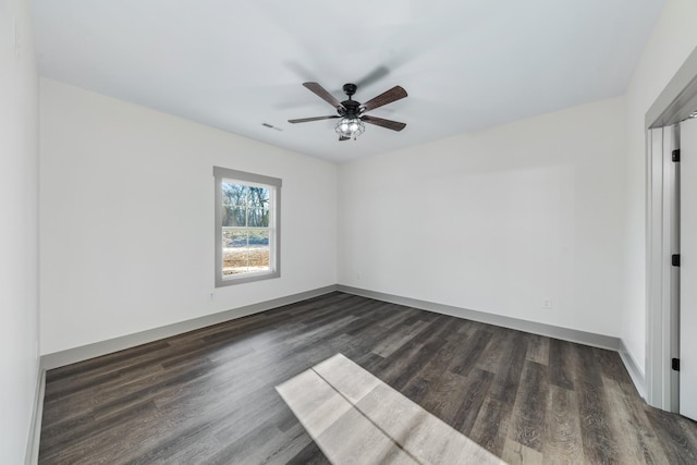 unfurnished room with ceiling fan and dark hardwood / wood-style floors