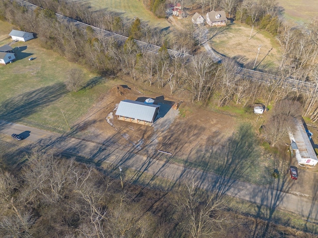 birds eye view of property with a rural view