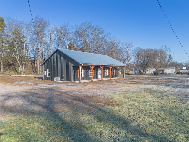 view of home's exterior featuring central AC unit and covered porch