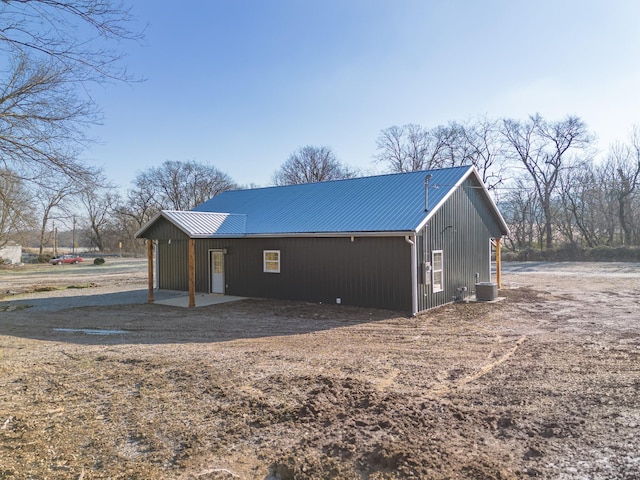 back of property with central AC