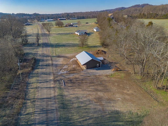 birds eye view of property featuring a rural view