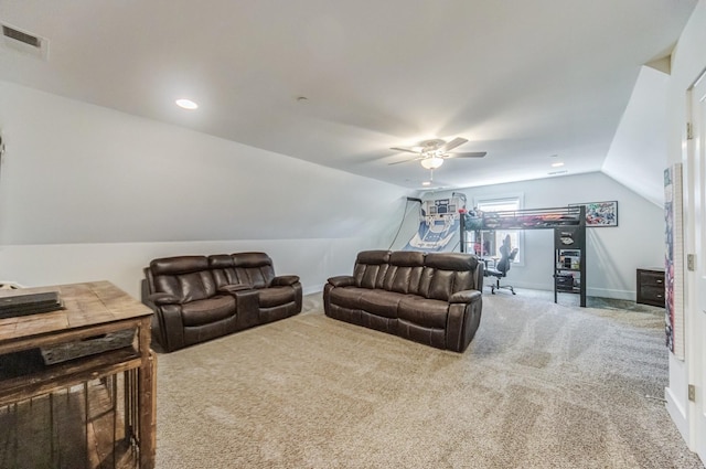 carpeted living room with vaulted ceiling and ceiling fan