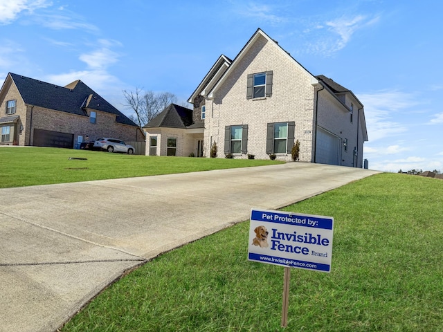 view of front of property with a garage and a front yard