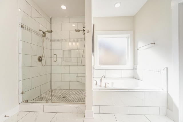 bathroom with shower with separate bathtub