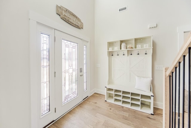 mudroom with light hardwood / wood-style flooring