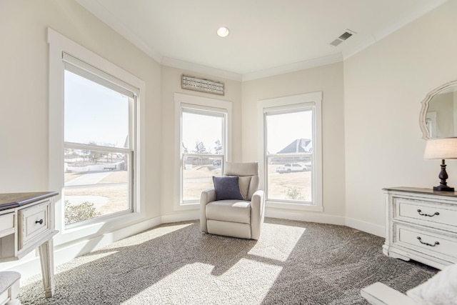 living area with ornamental molding and carpet flooring