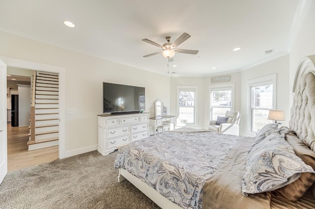 carpeted bedroom featuring ceiling fan