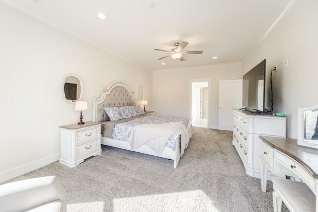 carpeted bedroom featuring ceiling fan and ornamental molding