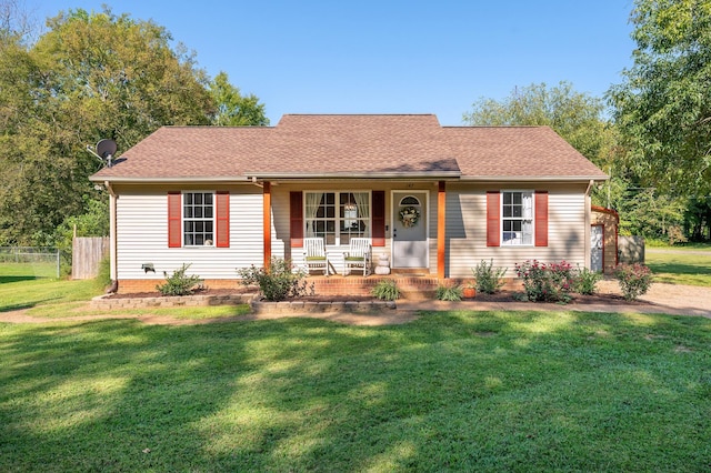 ranch-style house featuring a front yard and a porch