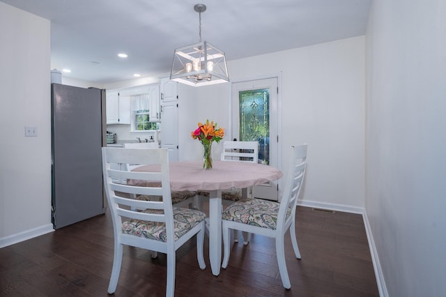 dining area featuring dark hardwood / wood-style floors