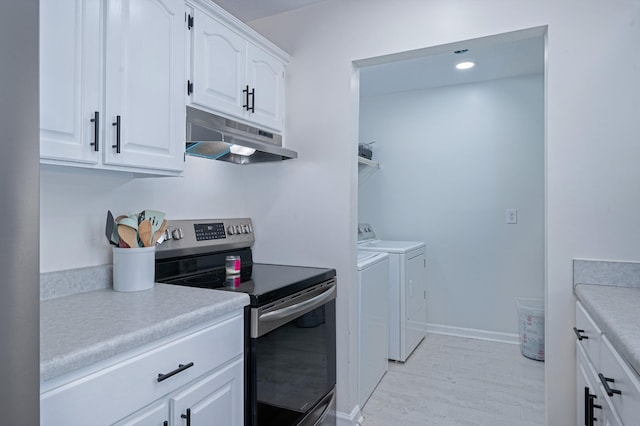 clothes washing area featuring washer and clothes dryer