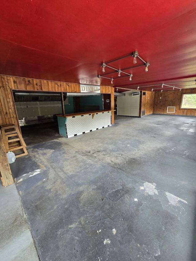 garage with wood walls