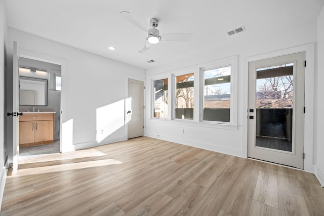 unfurnished room featuring light hardwood / wood-style floors and ceiling fan