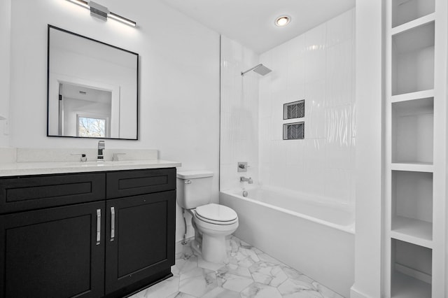 full bathroom featuring toilet, tiled shower / bath combo, and vanity