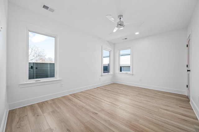 spare room featuring ceiling fan and light wood-type flooring