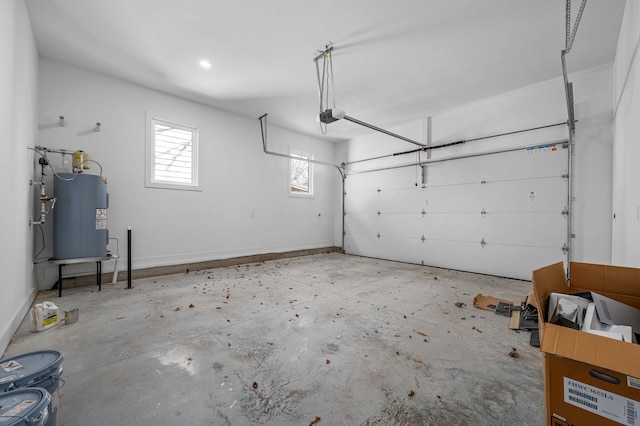 garage with water heater and a garage door opener