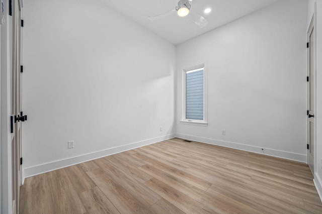 spare room featuring ceiling fan and light wood-type flooring