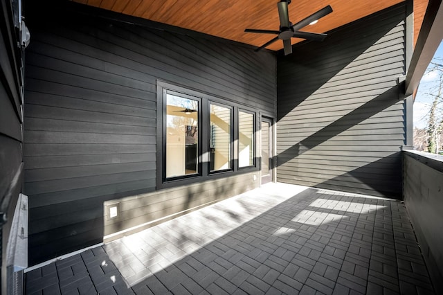 wooden terrace featuring ceiling fan