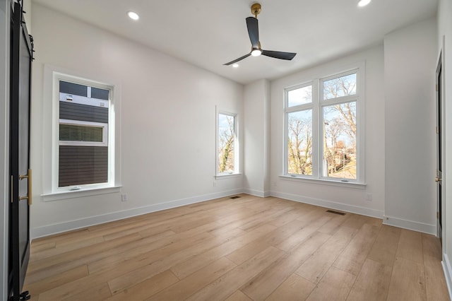 unfurnished room featuring ceiling fan and light wood-type flooring