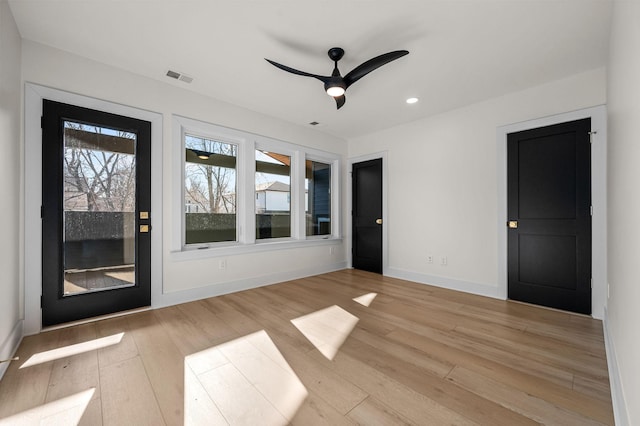 spare room featuring ceiling fan and light wood-type flooring