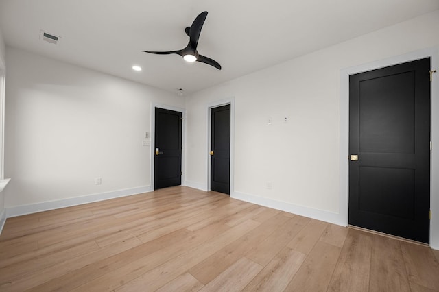 unfurnished bedroom with light wood-type flooring and ceiling fan