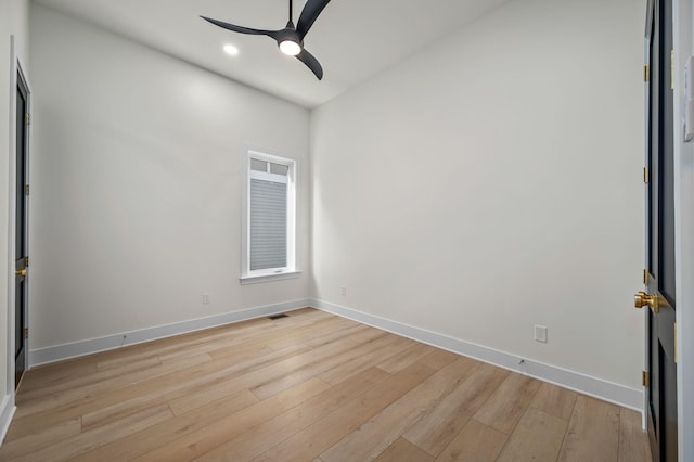 unfurnished room with ceiling fan and light wood-type flooring