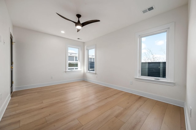 unfurnished room featuring light wood-type flooring and ceiling fan