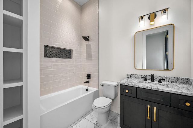 full bathroom featuring built in shelves, toilet, vanity, and tiled shower / bath