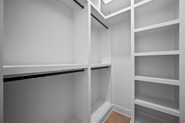 walk in closet featuring hardwood / wood-style floors