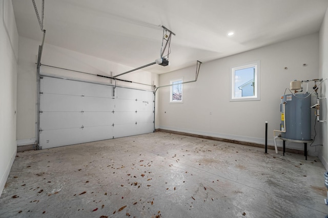 garage featuring water heater and a garage door opener