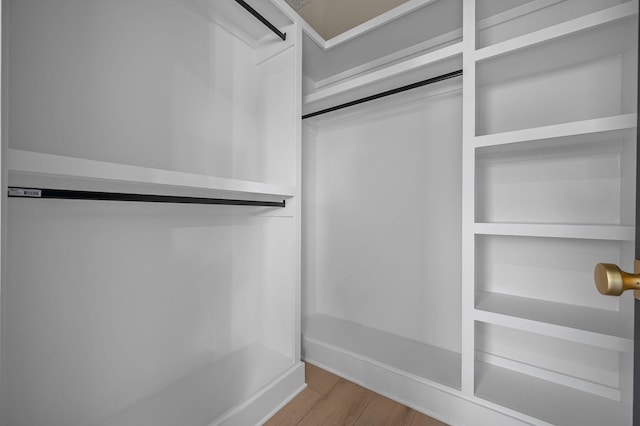 walk in closet featuring wood-type flooring