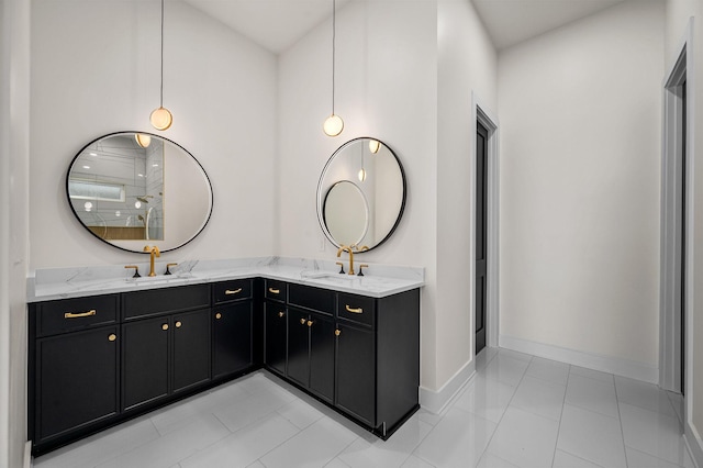 bathroom featuring vanity, tile patterned flooring, and a shower