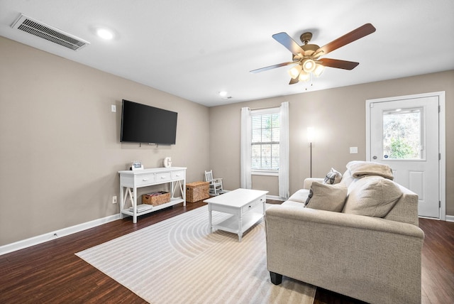 living room with ceiling fan and wood-type flooring