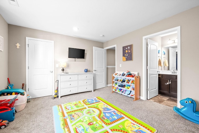 game room with light colored carpet and sink