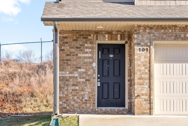 property entrance with a garage