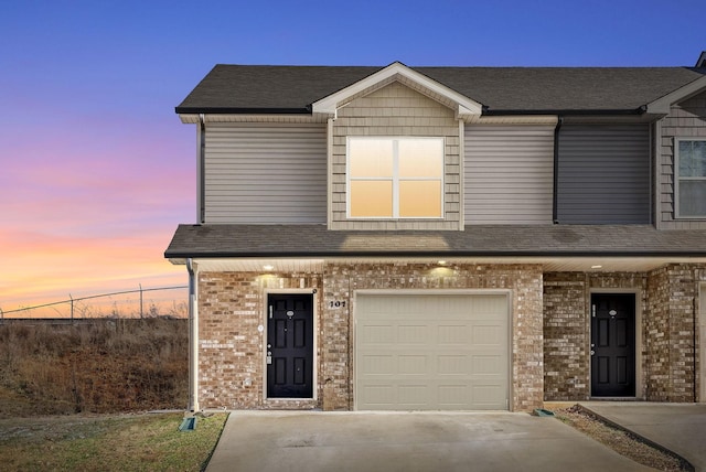 view of front of property with a garage