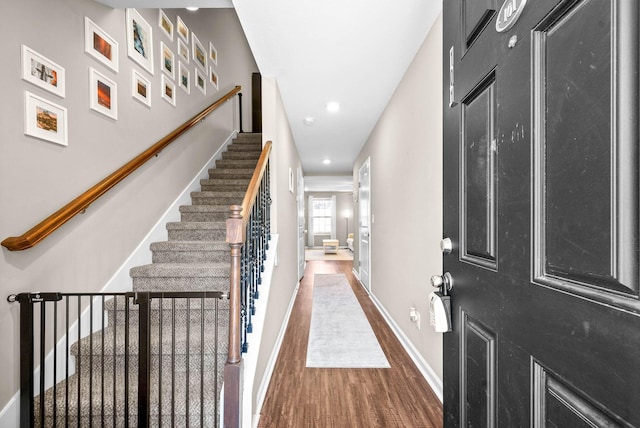 foyer entrance with dark wood-type flooring