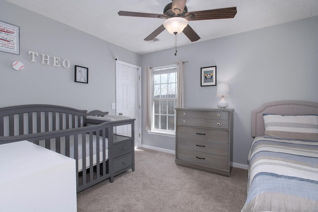 bedroom featuring ceiling fan and light carpet