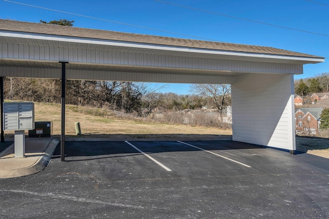 view of parking / parking lot with a carport