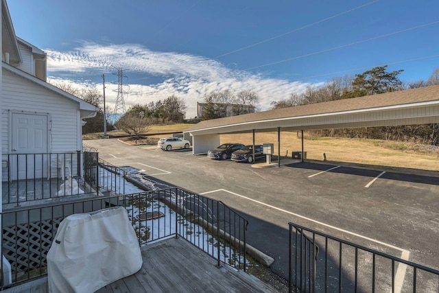 exterior space with a carport and grilling area