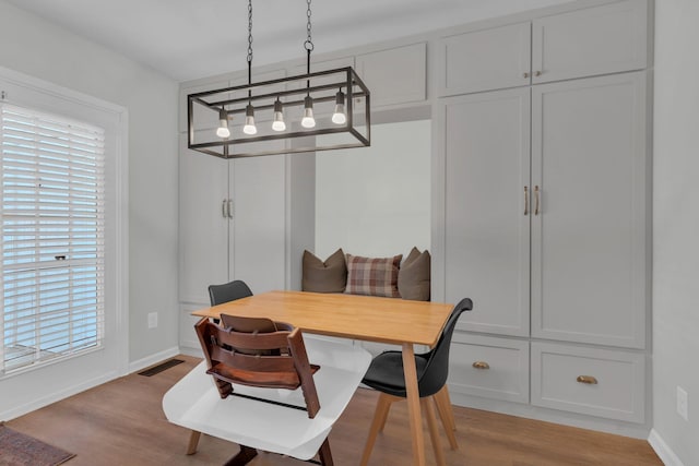 dining space with light wood-type flooring