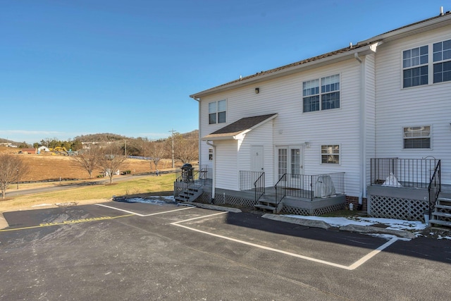 back of property featuring a wooden deck