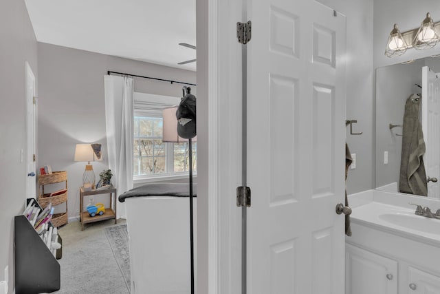 bathroom featuring a shower and vanity