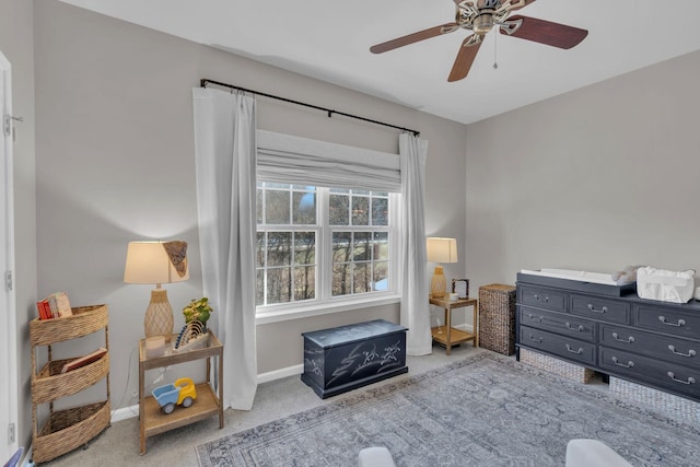 sitting room featuring ceiling fan and light colored carpet