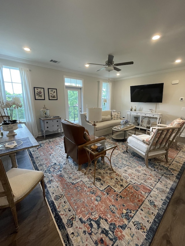 living room featuring ceiling fan, crown molding, and hardwood / wood-style floors