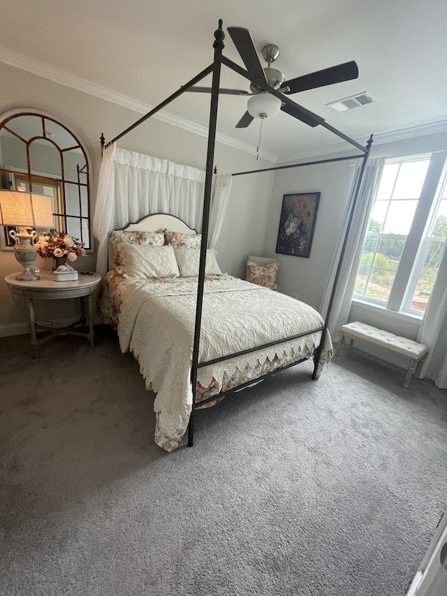 carpeted bedroom featuring ceiling fan and ornamental molding