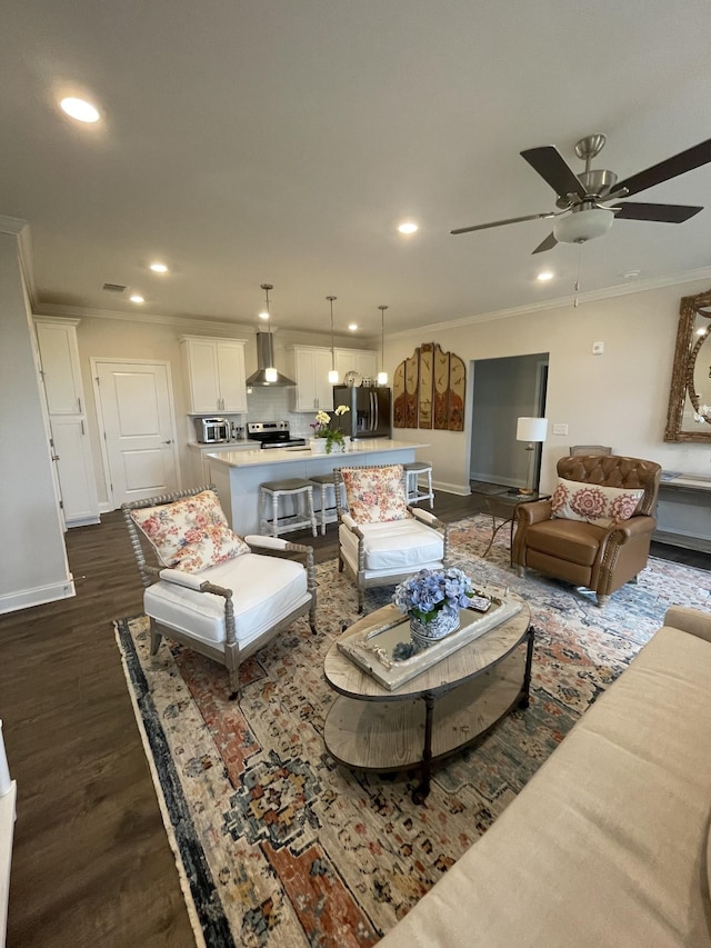 living room featuring ceiling fan, dark wood-type flooring, and ornamental molding