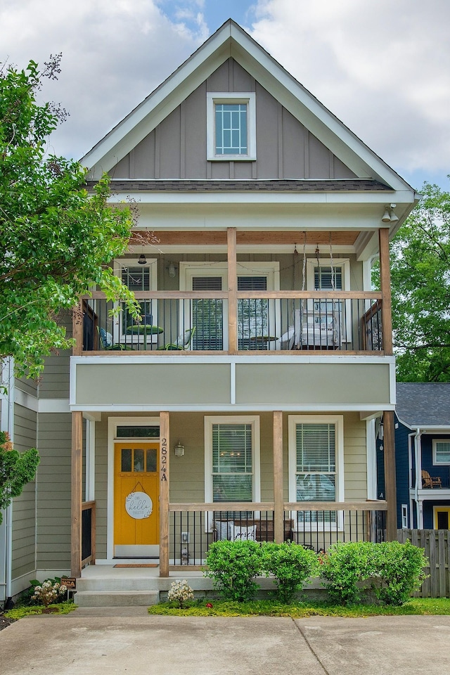 view of front of house with a balcony and covered porch